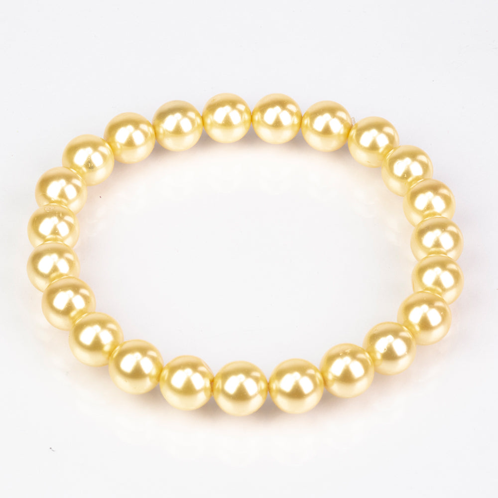 Conjunto de Plata Bañada en Oro con Perla de concha ( Pendientes +Pulsera )