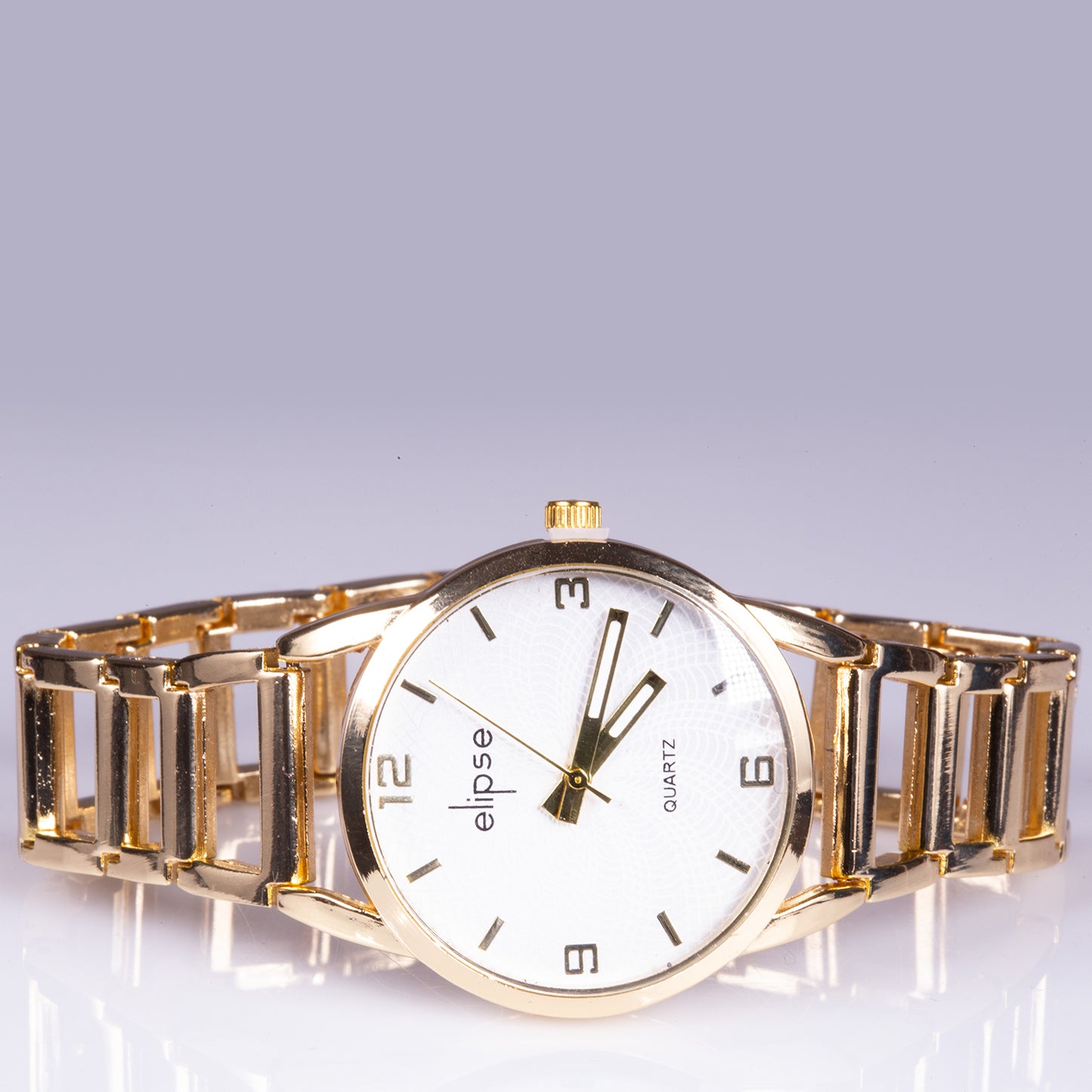Reloj de moda para mujer con banda de acero, color dorado