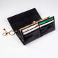 Cartera de privacidad con clave secreta de acceso para mujer. Color: negro y rojo