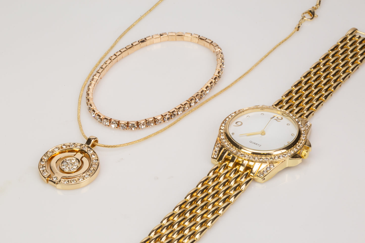 3 pieces Gold Plated Alloy Set of Quartz Watch (19 cm), stretchable Bracelet (21 cm) and pendant necklace (46 cm) with White Emporia Crystals, white dial